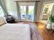 Bedroom showcasing an outdoor balcony and ensuite bathroom at 118 Chestnut St, Durham, NC 27707