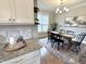 Dining room showcases a modern chandelier and an accent rug beneath a dark wood table at 118 Chestnut St, Durham, NC 27707