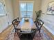 Bright dining room featuring a wooden table, black chairs, and a decorative area rug at 118 Chestnut St, Durham, NC 27707