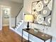 Foyer with hardwood floors, stylish decor, and a view of the stairway at 118 Chestnut St, Durham, NC 27707
