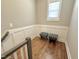 Stairway landing with hardwood floors and decorative board and batten at 118 Chestnut St, Durham, NC 27707