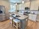 Charming kitchen with granite counters, a center island, and stainless steel appliances at 118 Chestnut St, Durham, NC 27707