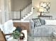 Stylish living room showcasing comfortable seating and a stairway in the background at 118 Chestnut St, Durham, NC 27707
