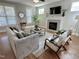 Bright living room with fireplace, hardwood floors, and comfortable seating at 118 Chestnut St, Durham, NC 27707