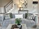 Comfortable living room with stylish furniture, decor, and stairway in view at 118 Chestnut St, Durham, NC 27707