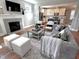 Open-concept living room featuring a fireplace and a view into the kitchen at 118 Chestnut St, Durham, NC 27707