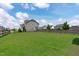 Enjoy outdoor living in this spacious backyard with lush green grass and a secure fence for privacy at 1214 Valley Dale Dr, Fuquay Varina, NC 27526