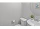 Clean half bathroom with a modern toilet and stylish sink at 1214 Valley Dale Dr, Fuquay Varina, NC 27526