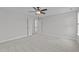 This expansive bedroom features plush carpeting, neutral walls, and a ceiling fan for a comfortable living space at 1214 Valley Dale Dr, Fuquay Varina, NC 27526