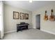 Cozy bedroom with carpet, decorated with guitars and music-themed artwork at 1214 Valley Dale Dr, Fuquay Varina, NC 27526