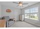 This bedroom features neutral walls, carpet, ceiling fan, large window and closet, perfect for relaxation and comfort at 1214 Valley Dale Dr, Fuquay Varina, NC 27526