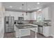 A kitchen with white cabinetry, stainless appliances, and a center island at 1214 Valley Dale Dr, Fuquay Varina, NC 27526