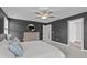 Comfortable carpeted main bedroom featuring modern ceiling fan, stylish color palette, and ample natural light at 1214 Valley Dale Dr, Fuquay Varina, NC 27526