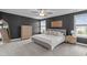 Spacious main bedroom features large windows and a comfortable bed at 1214 Valley Dale Dr, Fuquay Varina, NC 27526