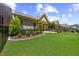 Expansive backyard with manicured lawn, stone patio, and professional landscaping for outdoor enjoyment at 122 Glenpark Pl, Cary, NC 27511