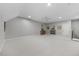 Spacious basement with a fireplace, carpeted floors, and neutral colored walls at 122 Glenpark Pl, Cary, NC 27511