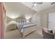Cozy bedroom features carpeted floors, ceiling fan, and bedside lamps at 122 Glenpark Pl, Cary, NC 27511