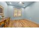Light filled bedroom features wood floors, plantation shutters, and recessed lighting at 122 Glenpark Pl, Cary, NC 27511