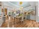 The dining area features wood floors and a decorated ceiling at 122 Glenpark Pl, Cary, NC 27511