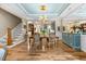 The dining area features wood floors and a decorated ceiling at 122 Glenpark Pl, Cary, NC 27511