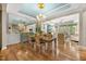 The dining area features wood floors and a decorated ceiling at 122 Glenpark Pl, Cary, NC 27511