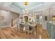 The dining area features wood floors and a decorated ceiling at 122 Glenpark Pl, Cary, NC 27511