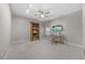 Neutral home office with desk, book shelf, ceiling fan and carpeted floors at 122 Glenpark Pl, Cary, NC 27511