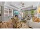 A sun-filled living room offers built-in shelving, a fireplace, and outdoor access at 122 Glenpark Pl, Cary, NC 27511