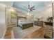 Spacious main bedroom suite with floral wallpaper, tray ceiling, and lots of natural light at 122 Glenpark Pl, Cary, NC 27511