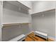 Well organized walk-in closet featuring built-in shelving at 122 Glenpark Pl, Cary, NC 27511