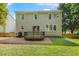 Back exterior featuring a wood deck, patio and grass at 12620 Waterlow Park Ln, Raleigh, NC 27614