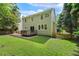 Back exterior featuring a wood deck, patio and grass at 12620 Waterlow Park Ln, Raleigh, NC 27614