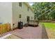 A large back of the house features a patio and a wood deck at 12620 Waterlow Park Ln, Raleigh, NC 27614