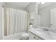 Bathroom with bathtub and shower combination, marble countertop sink and neutral design at 12620 Waterlow Park Ln, Raleigh, NC 27614