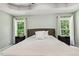 Spacious bedroom with serene decor, trey ceiling, and large windows with natural light at 12620 Waterlow Park Ln, Raleigh, NC 27614