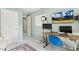 Comfortable bedroom featuring a desk, TV, and a cozy rug at 12620 Waterlow Park Ln, Raleigh, NC 27614