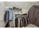 Well-organized walk-in closet with ample shelving and hanging space for clothing storage at 12620 Waterlow Park Ln, Raleigh, NC 27614