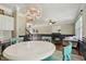 A view of the kitchen and living spaces from the breakfast nook chandelier at 12620 Waterlow Park Ln, Raleigh, NC 27614