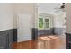 Bright living room featuring hardwood floors, a ceiling fan, and decorative wall trim at 12620 Waterlow Park Ln, Raleigh, NC 27614