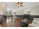 Spacious living room featuring hardwood floors, wainscoting, and a fireplace at 12620 Waterlow Park Ln, Raleigh, NC 27614
