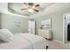 Comfortable main bedroom with tray ceiling, neutral paint, and walk-in closet, providing a serene retreat at 12620 Waterlow Park Ln, Raleigh, NC 27614