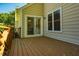 Cozy wooden back porch with glass slider door access at 13 Boxwood Dr, Durham, NC 27713