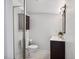 Compact bathroom featuring standing shower and dark wood vanity at 13 Boxwood Dr, Durham, NC 27713