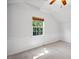Bright bedroom featuring large window, neutral carpet and wainscoting at 13 Boxwood Dr, Durham, NC 27713