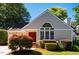 Charming single-story home featuring a red front door, well-manicured landscaping, and a bright, inviting facade at 13 Boxwood Dr, Durham, NC 27713