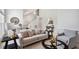 Bright and open living space featuring neutral tones, comfortable seating, and an open staircase at 13 Boxwood Dr, Durham, NC 27713