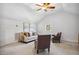 Cozy living room with neutral color palette, fan, and window at 13 Boxwood Dr, Durham, NC 27713