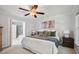 The main bedroom features a large bed, ensuite bathroom, and is brightly lit at 13 Boxwood Dr, Durham, NC 27713