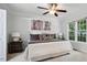 The main bedroom features a large window, neutral decor, and a comfortable king-size bed at 13 Boxwood Dr, Durham, NC 27713