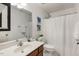 Well-lit bathroom featuring a vanity, toilet, and shower with neutral colors at 131 Abacos Ct, Clayton, NC 27520